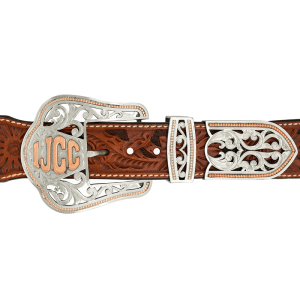 A custom western three piece belt buckle set featuring antiqued silver scrollwork and golden sunflowers 